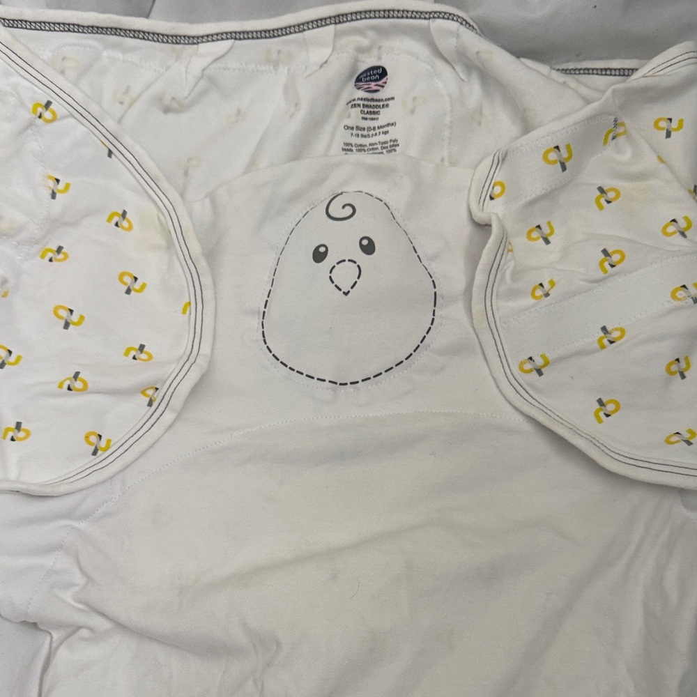 Nested Bean Cream Swaddle with Subtle Yellow Highlights